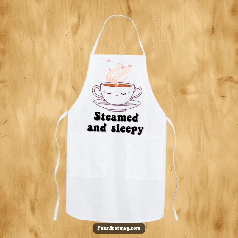 Funny Napping Teacup Apron: Kitchen apron featuring a cute napping teacup amidst a swirling steam cloud, perfect for a funny, relaxing cooking experience.