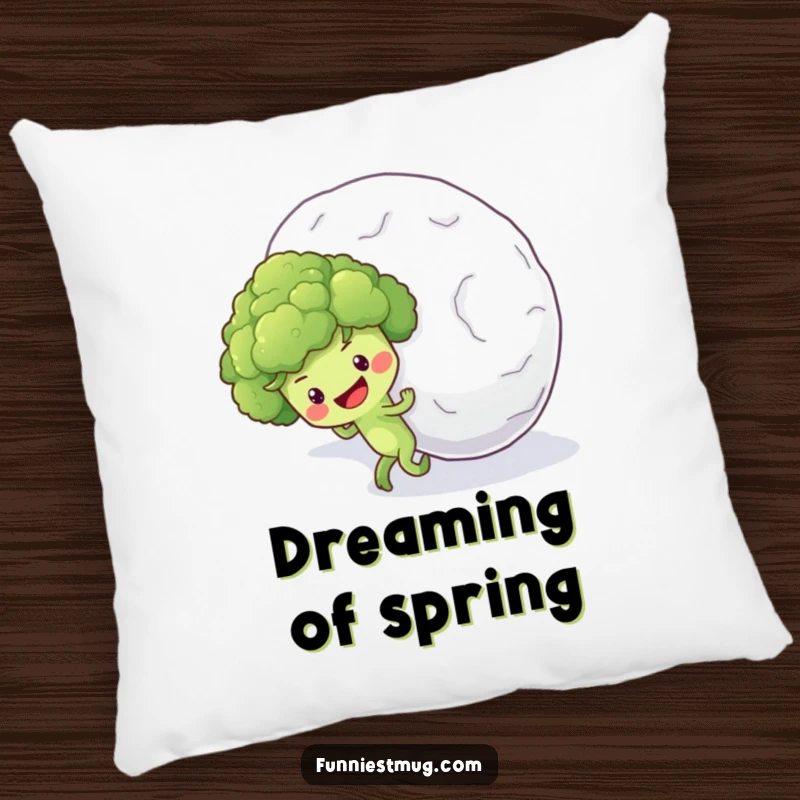 Funny pillow design of an optimistic broccoli floret character earnestly pushing a massive snowball uphill.