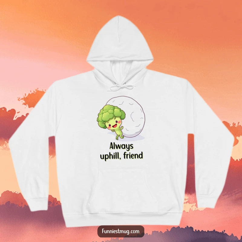 Funny hoodie featuring a determined broccoli floret character struggling to push a huge snowball up a snowy incline.