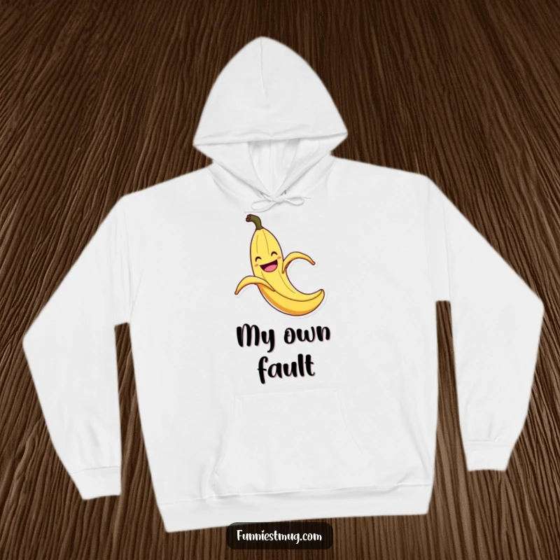 Funny Banana Peel Slip Hoodie: Warm sweatshirt with a grinning banana peel in mid-slip with exaggerated flair, a funny and cozy addition.