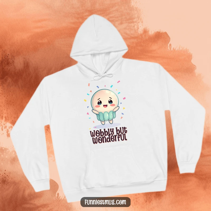 Funny Jelly Joy Hoodie featuring a wobbly jelly character with bewildered joy, catching confetti, providing warmth and humorous charm.