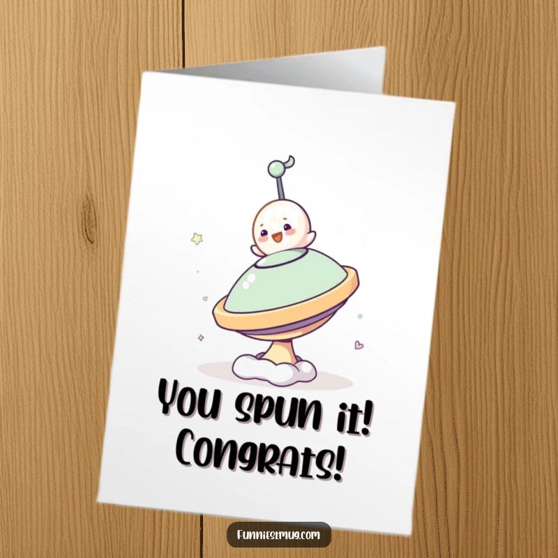 Funny Free Printable Congratulations Card featuring a small blob character's comical attempt to ride a huge, fast-spinning top.