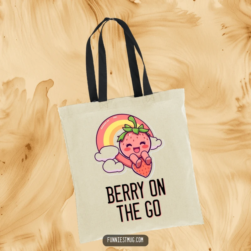 Funny tote bag depicting a cheerful strawberry character joyfully sliding down a spectacular rainbow, illustrating a whimsical and adventurous journey.