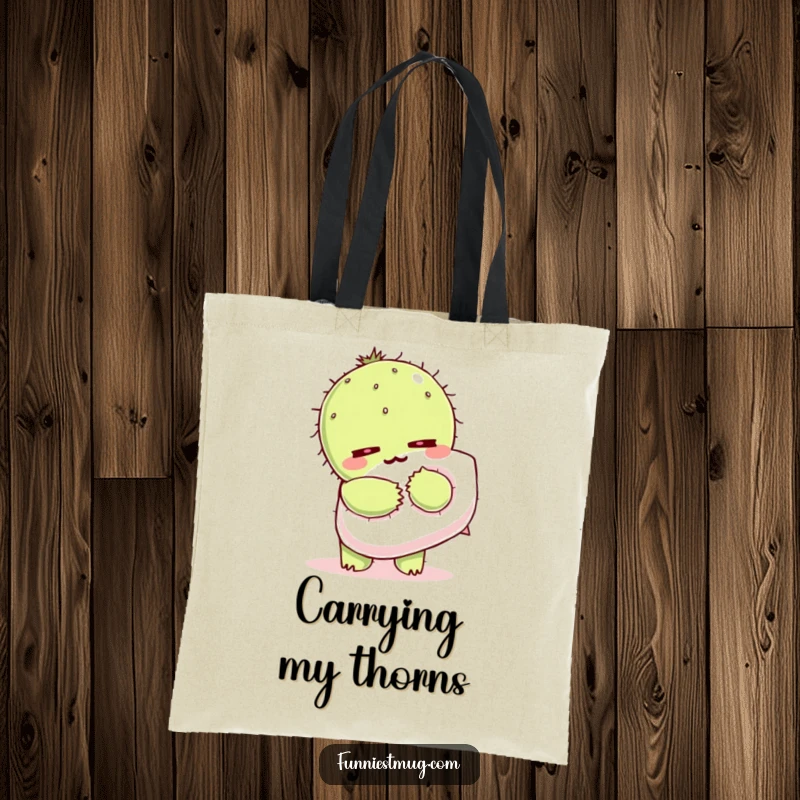 Funny Kawaii tote bag featuring a cactus character wincing as it hugs a fluffy pillow.