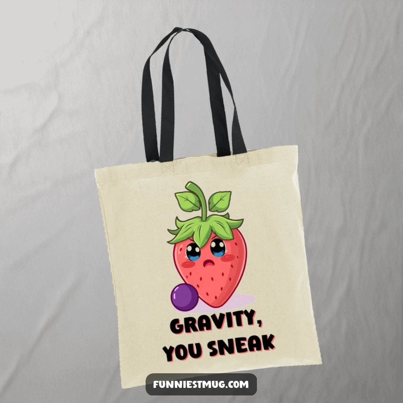 Funny strawberry character mid-fall on a grape, featured on a sturdy tote bag for humorous shopping trips and funny gifts.